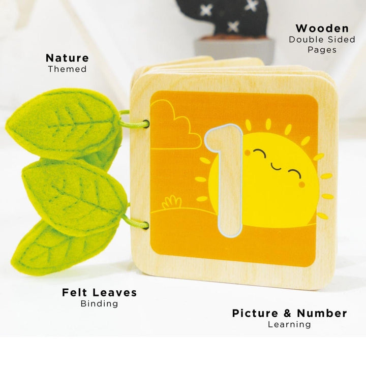 Wooden book with sun and number 1 design, green felt leaves, and nature-themed text on a white background.