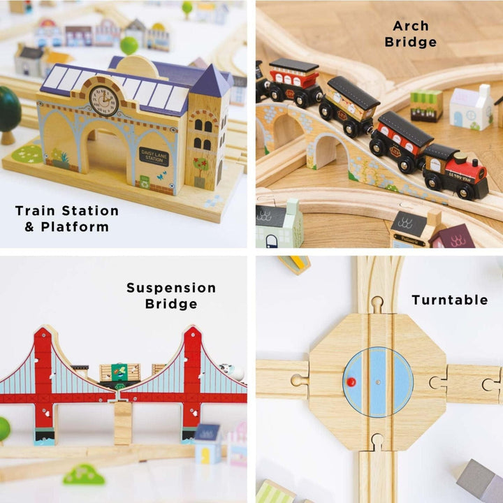 Wooden toy train set with various components including a station, bridges, and turntable.