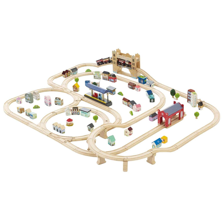 Wooden toy train set with tracks and buildings on a white background