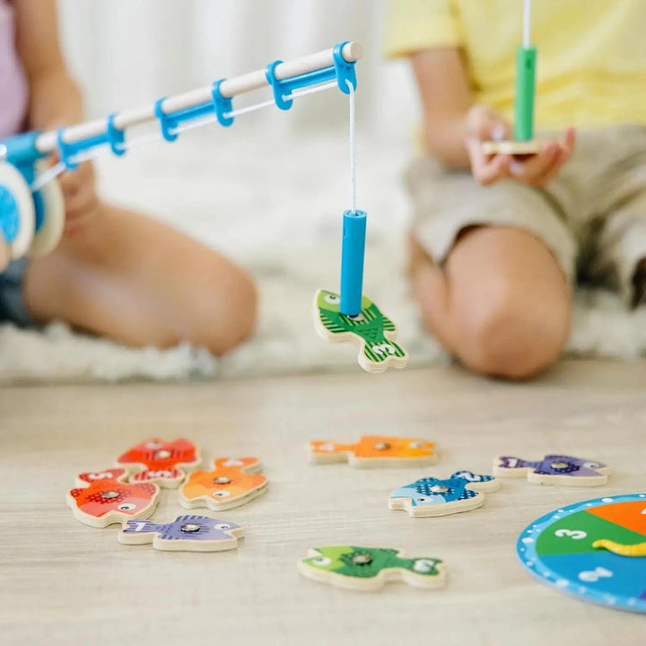 Close up of a fishing rod catching a magnetic toy fish