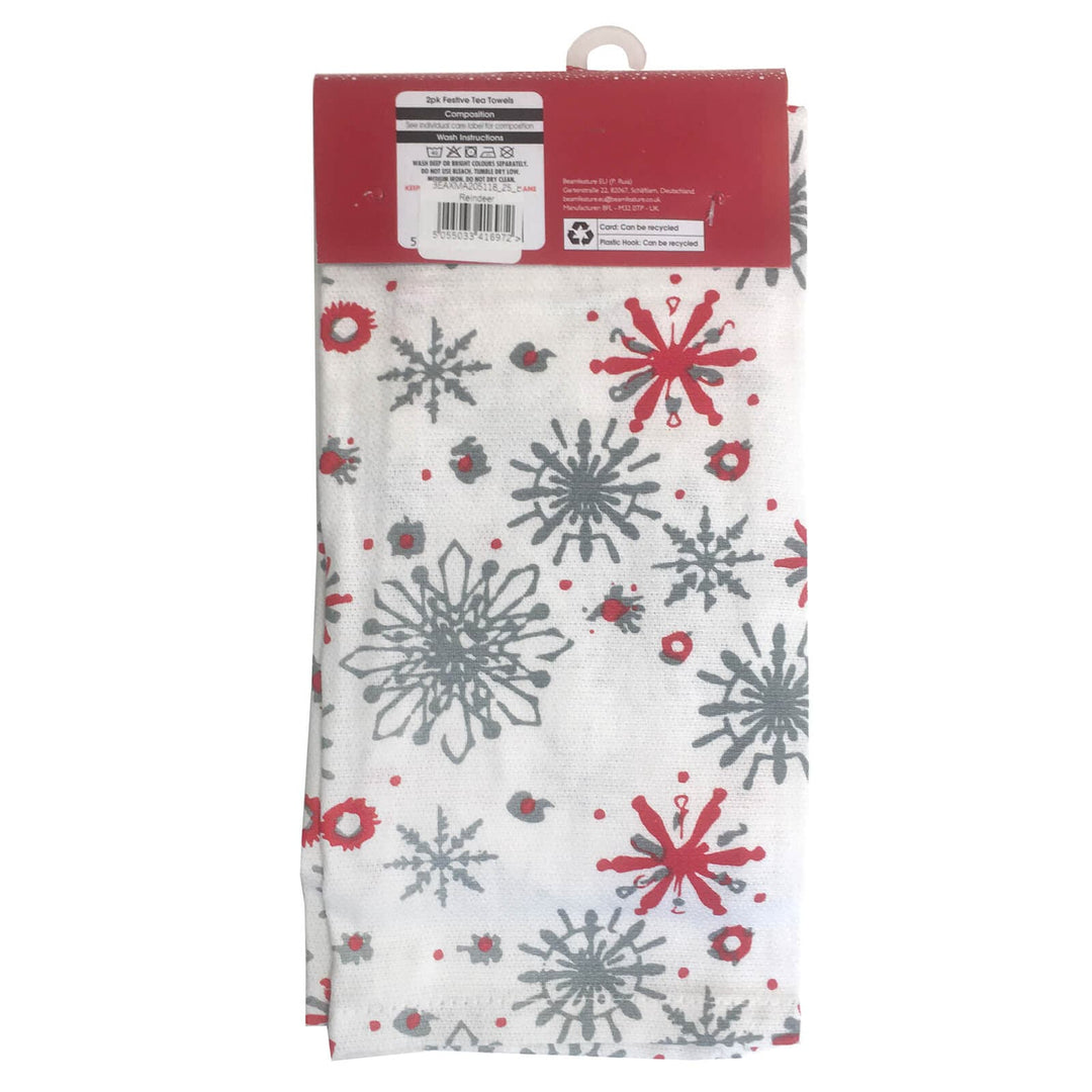 Packaged towel with red and gray snowflake pattern on a white background