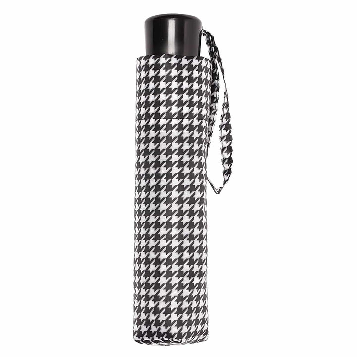 Mini umbrella with black and white dogtooth pattern matching storage sleeve