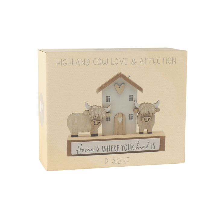 Decorative plaque with Highland cows and a house in packaging on a white background