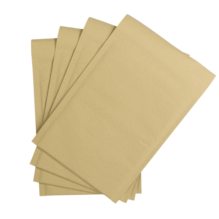 front view of 4 brown paper enveloped piled together on white background