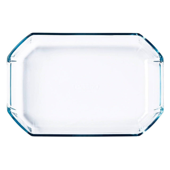 Overhead view of a glass rectangular oven dish on a white background