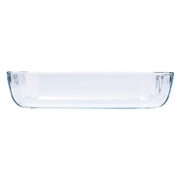 Side profile of a glass rectangular oven dish on a white background