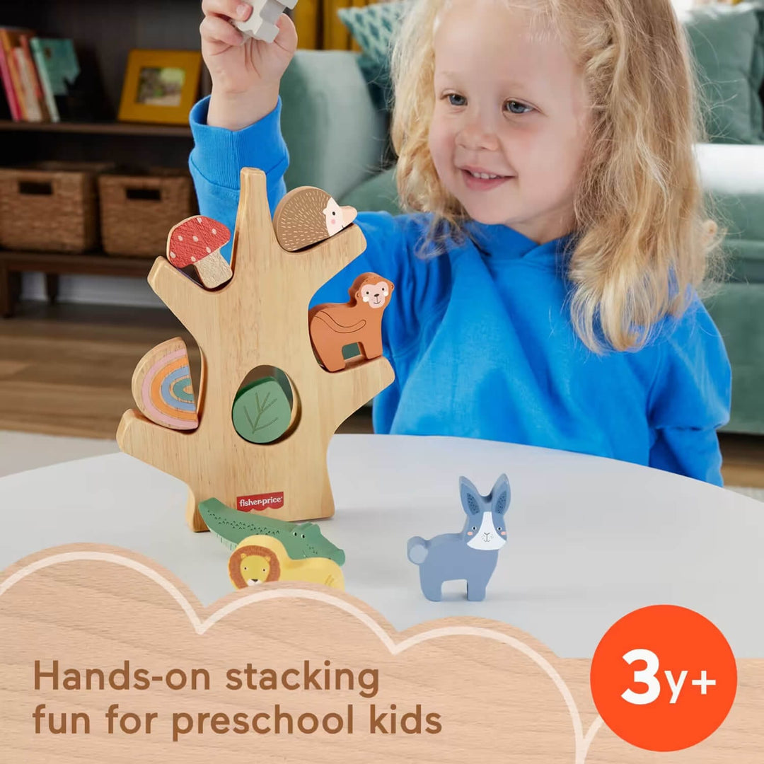 Child playing with a wooden tree-shaped toy with animal figures, sitting at a table.