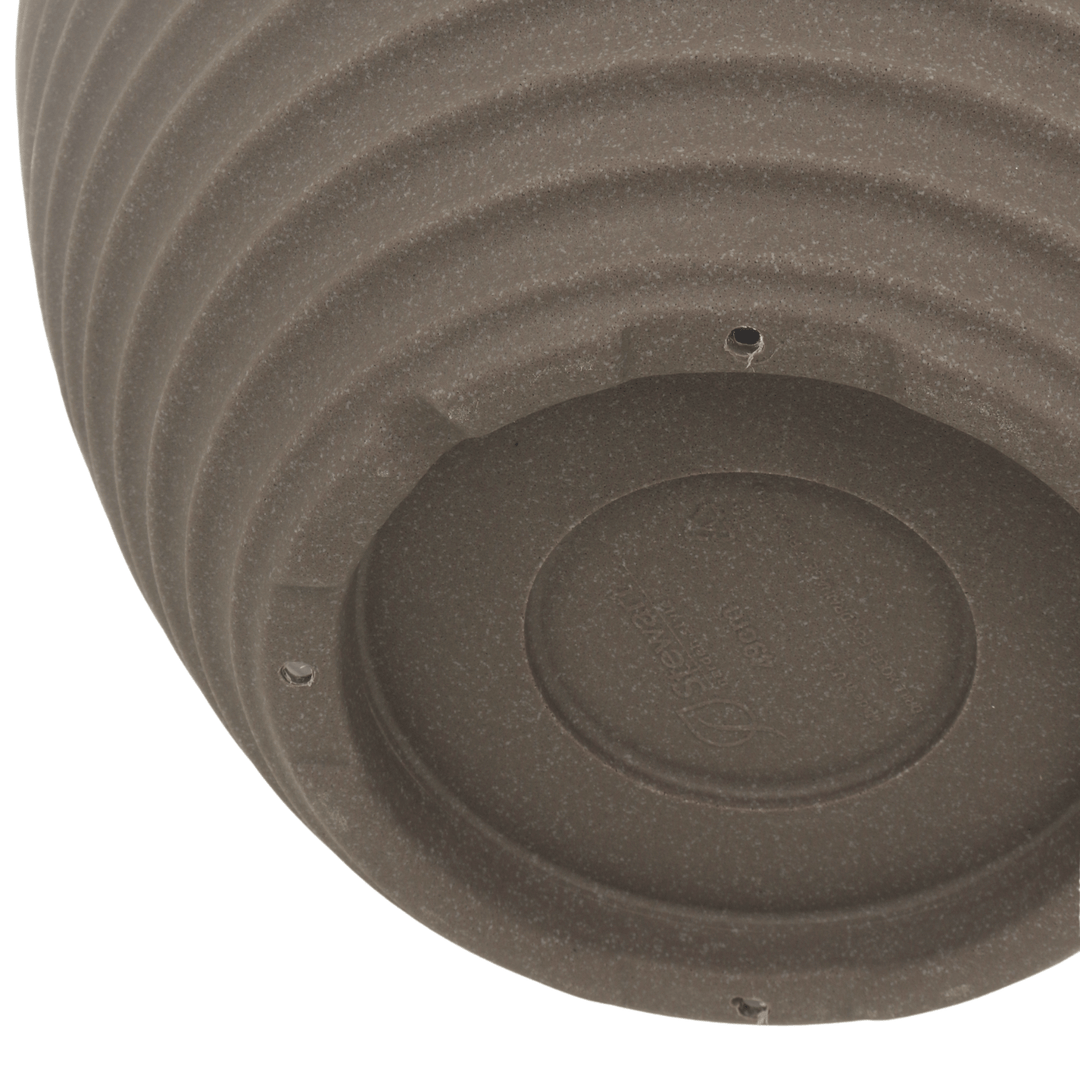 detail shot of drainage holes to the base of the pot