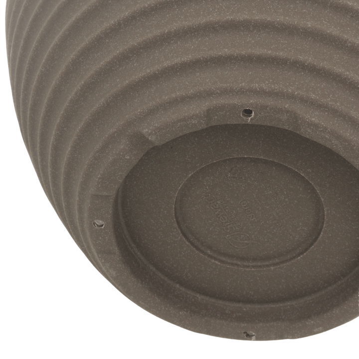 detail shot of drainage holes to the base of the pot