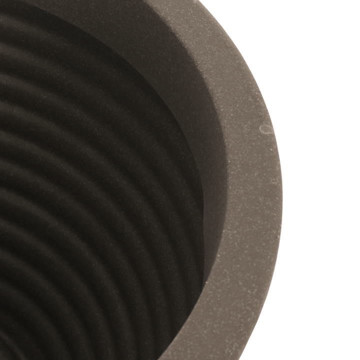 detail shot of stone effect material at the top of the pot