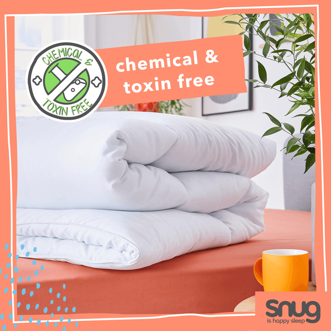 duvet folded on a bed with 'chemical & toxin free' label and 'snug' branding.