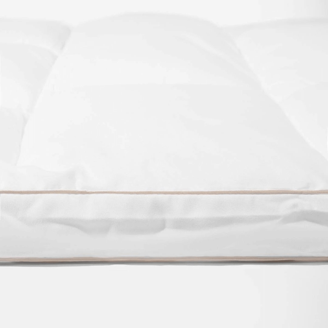 White topper with a thin gold stripe on a white background