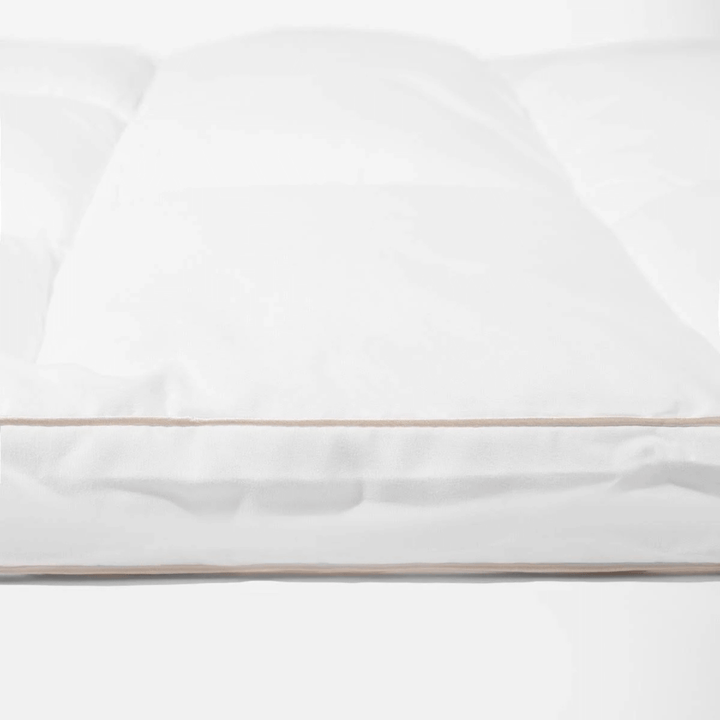 White topper with a thin gold stripe on a white background
