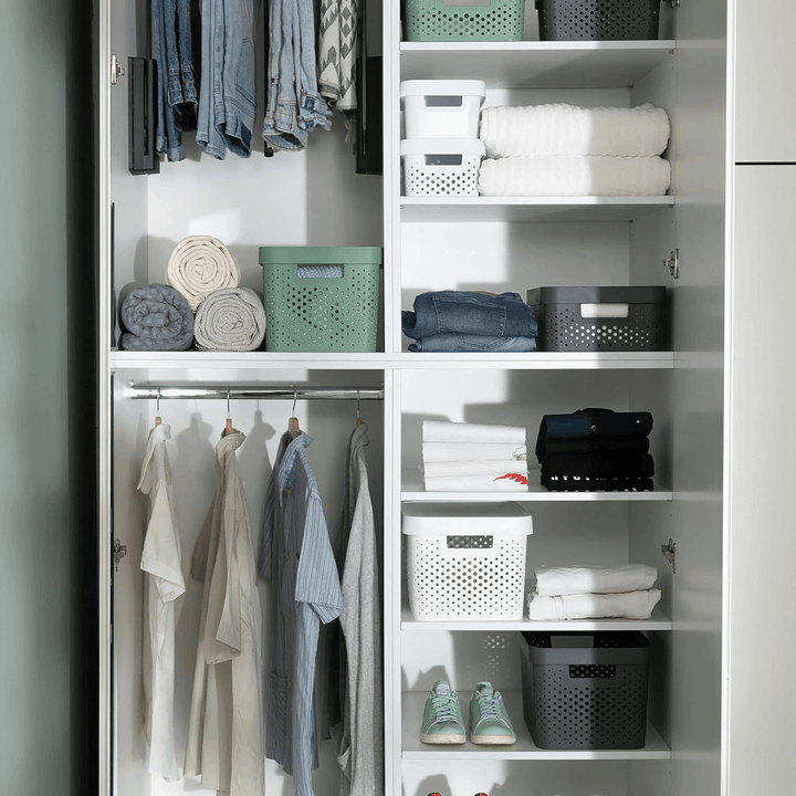 organised wardrobe with infinity dots storage boxes in a range of colours storing clothes