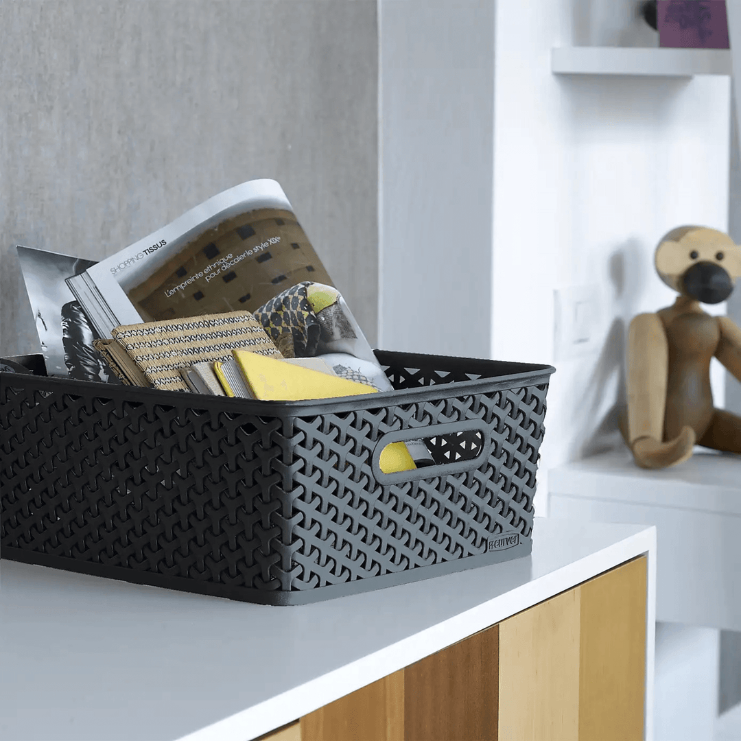 medium storage basket on bedroom counter with magazines and notebookes stored inside