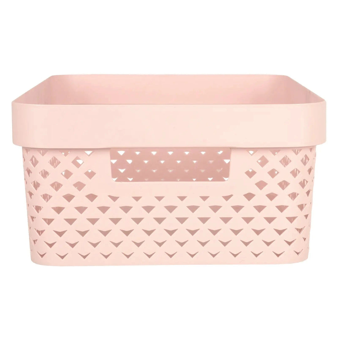 Side view of handle and pattern on a small pink Curver Pure storage basket