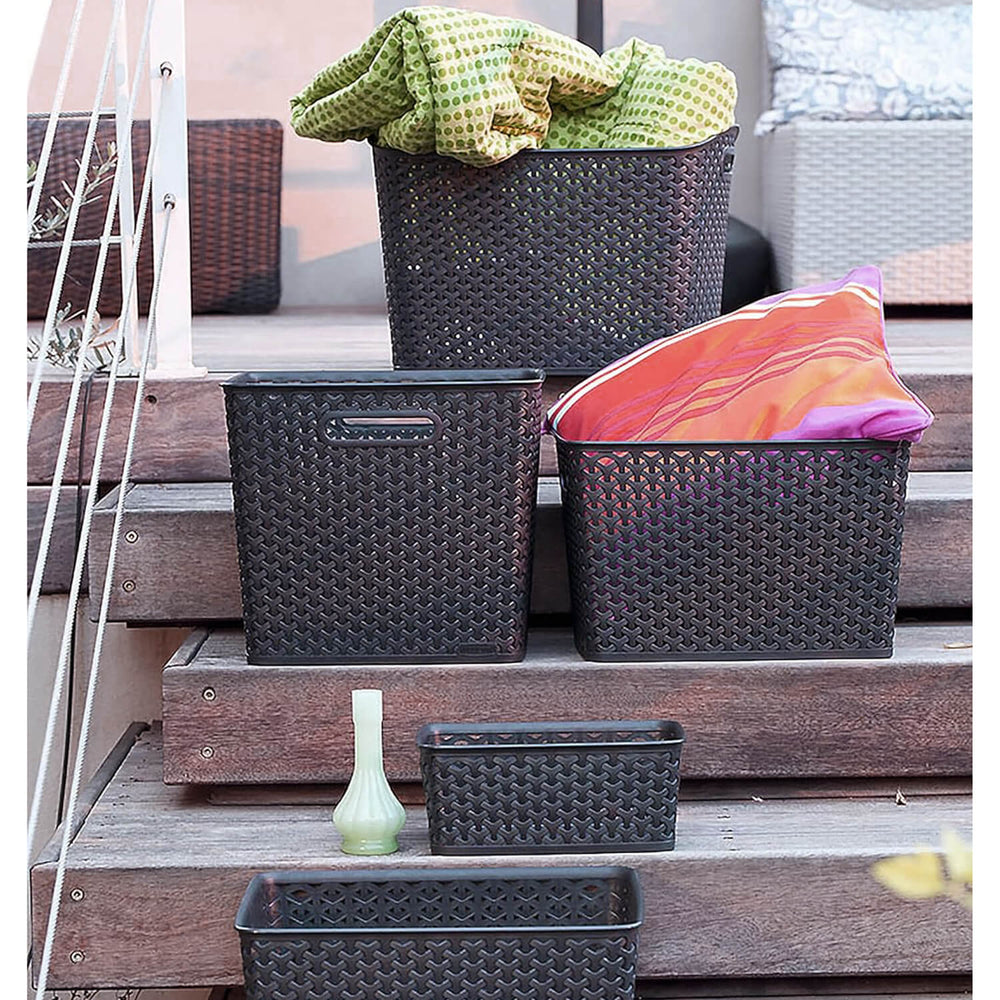 Woven style dark grey storage baskets on decking steps