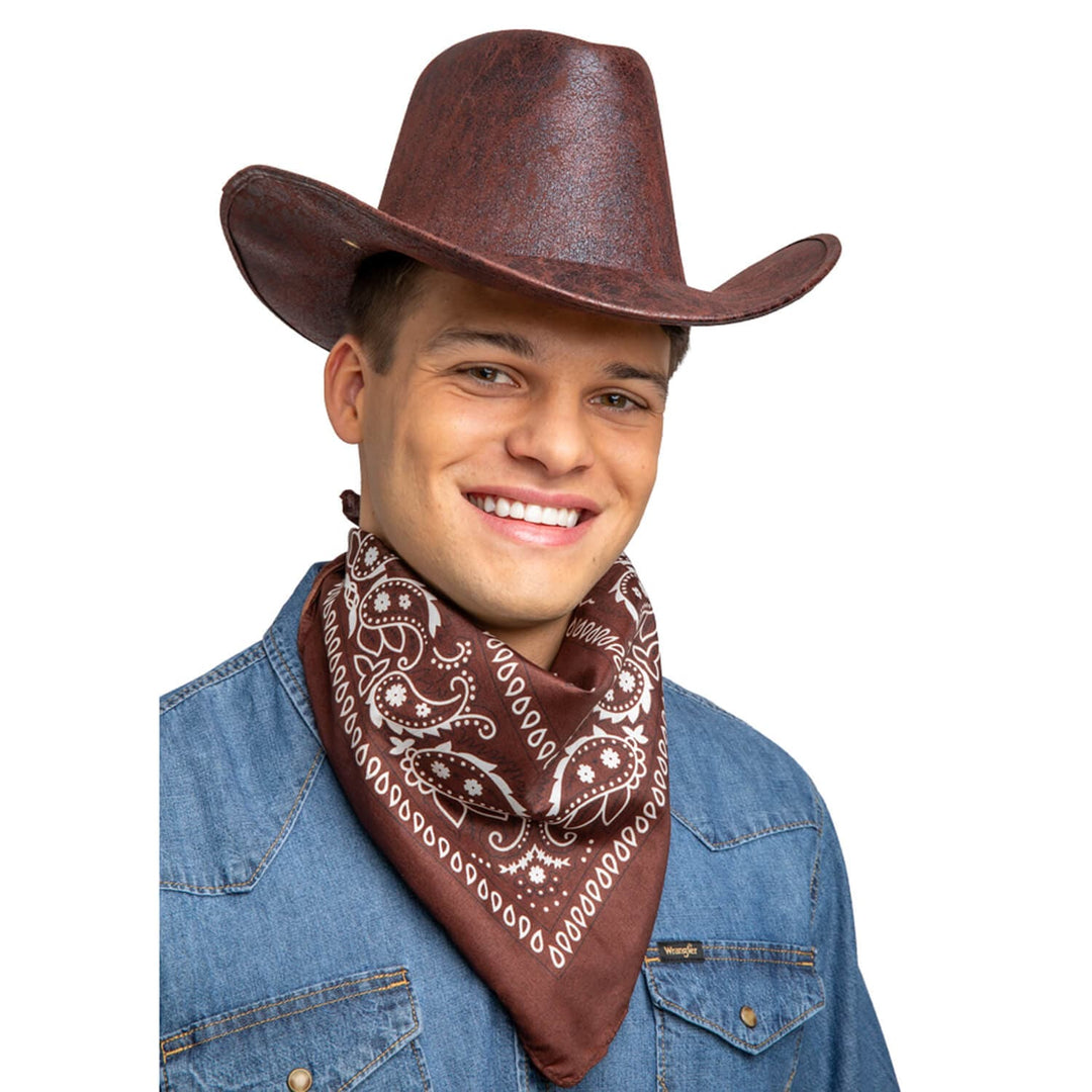 Man wearing a brown and white bandana and brown cowboy hat for fancy dress parties