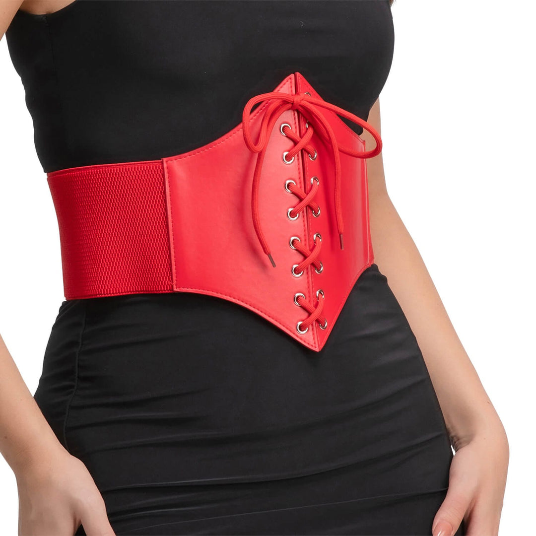 A red waist corset belt with lace-up front and wide elastic side panels, worn by a model in a black dress against a white background.