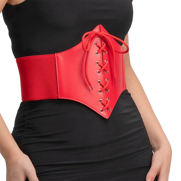 A red waist corset belt with lace-up front and wide elastic side panels, worn by a model in a black dress against a white background.