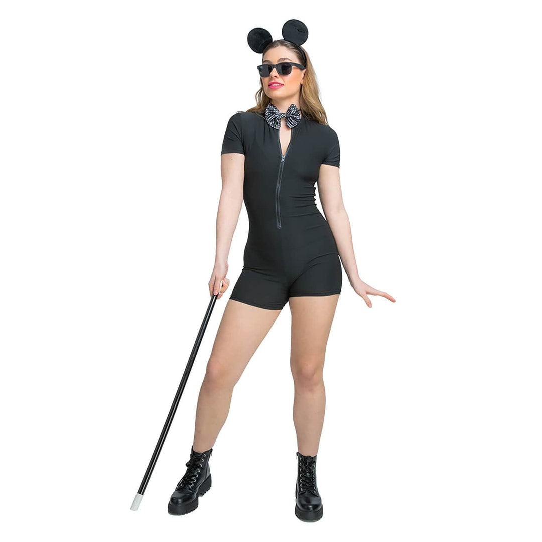 Woman wearing a black romper with mouse ears and a bow tie, holding a cane on a white background
