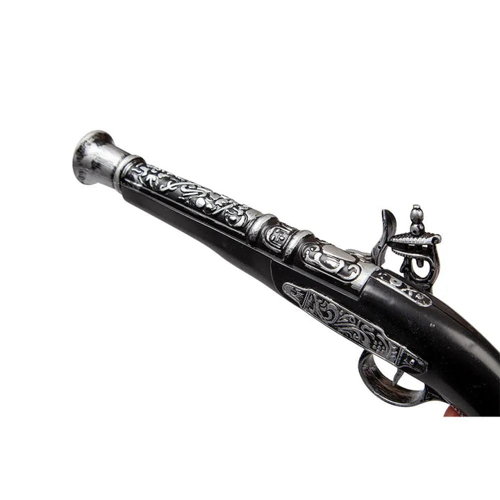 Close up of the black and silver plastic pistol for pirates fancy dress costumes