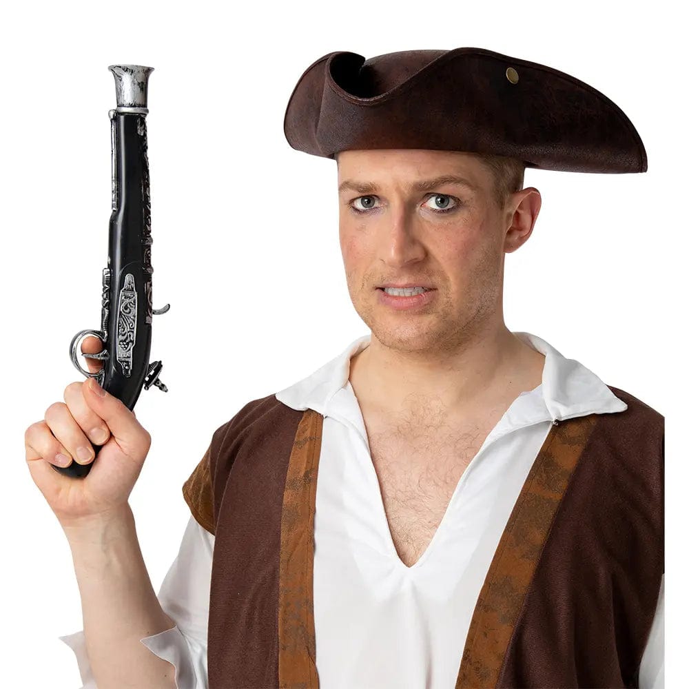Man wearing a pirate hat and costume holding a black and silver replica flintlock pistol