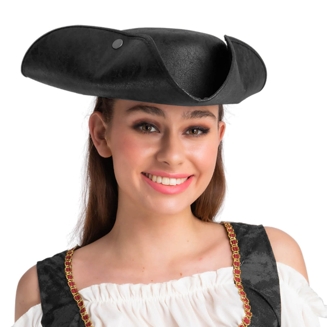 Woman wearing a black faux leather pirate hat on a white background