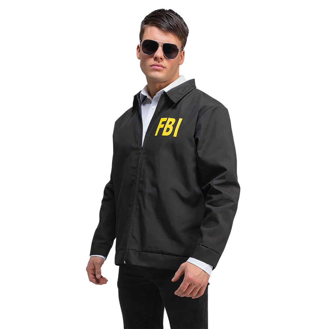 Man in a black FBI jacket and black shades for a fancy dress party