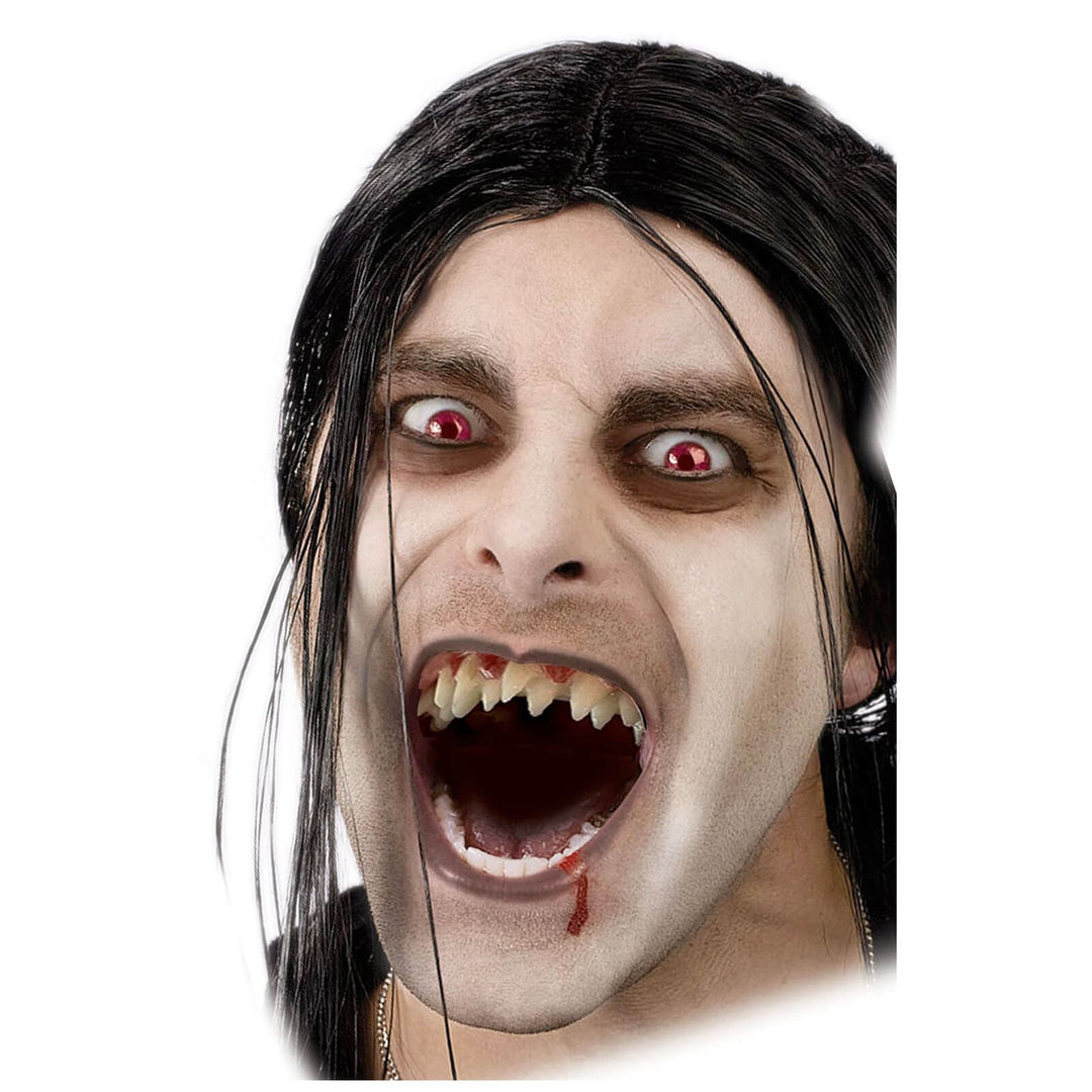 Man wearing a double fang set of dentures for Halloween