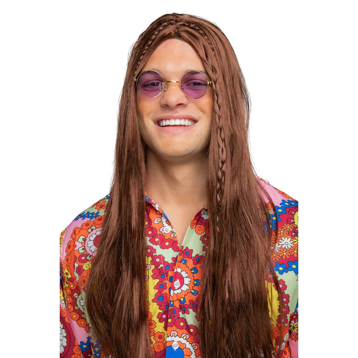 Person wearing a brown wig, purple tinted glasses and hippie shirt on a white background