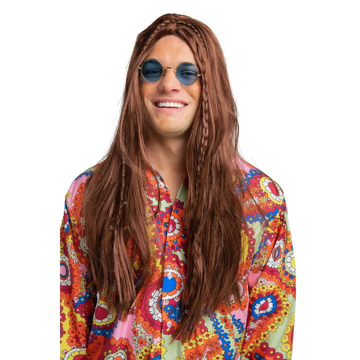 Person wearing a hippie shirt and long brown wig with blue tintedsunglasses on a white background