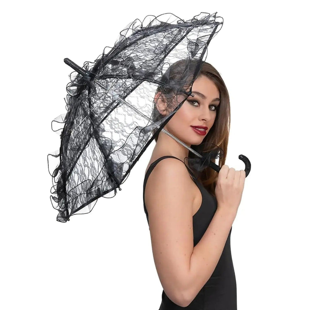 Young lady holding a black Gothic parasol for vintage fancy dress costumes