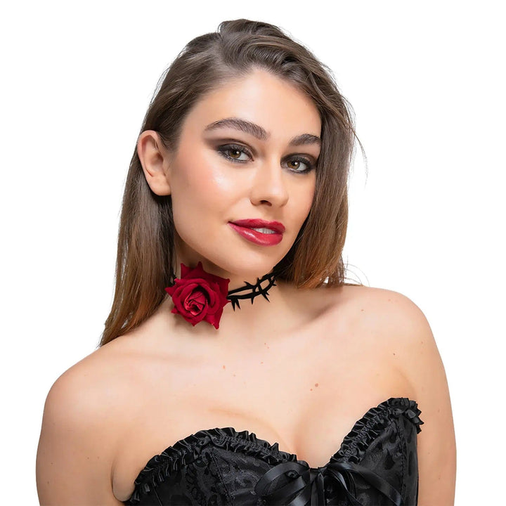 Woman wearing a black thorn choker with red velvet rose for Day of the Dead or Halloween fancy dress costumes