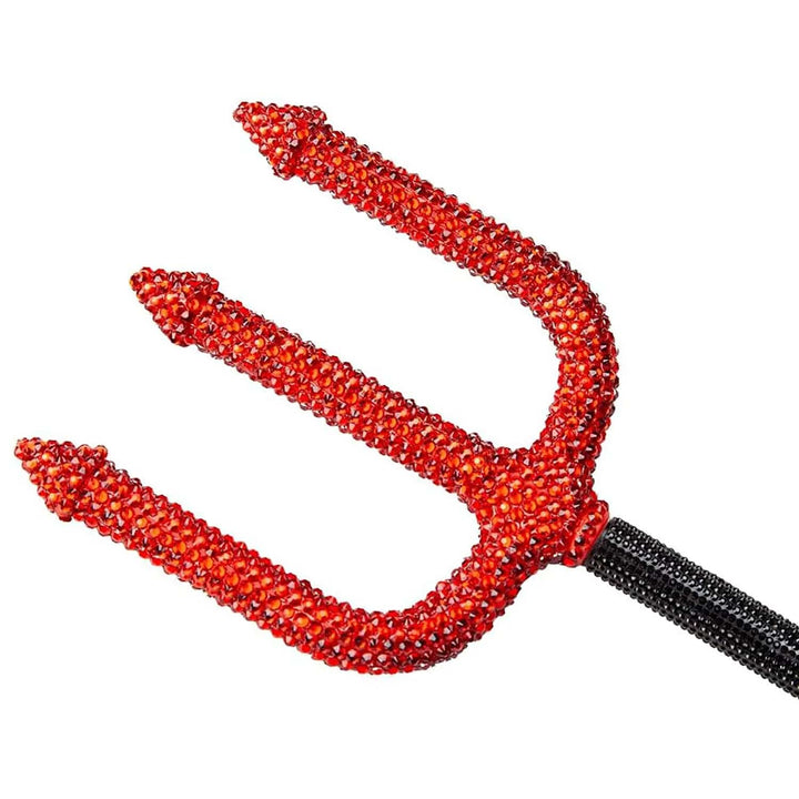 Close up of sparkling red rhinestones on a devil's trident costume prop