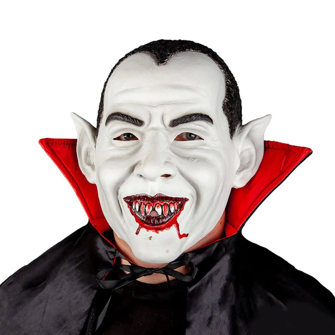 Man wearing a bloodthirsty vampire mask with fake blood round the mouht