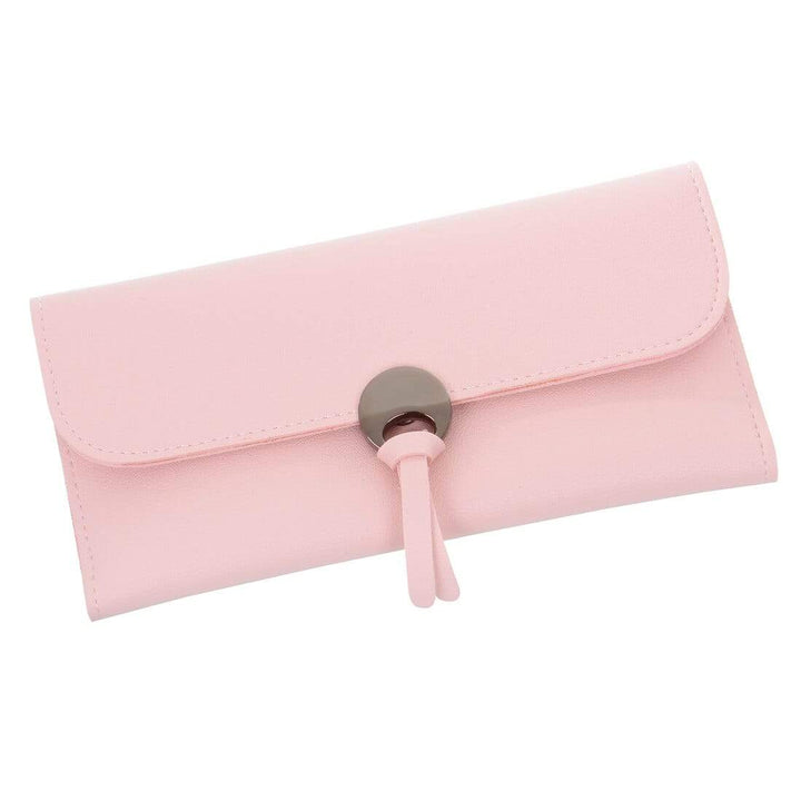 Pastel pink clutch purse with stud fastener on a white background