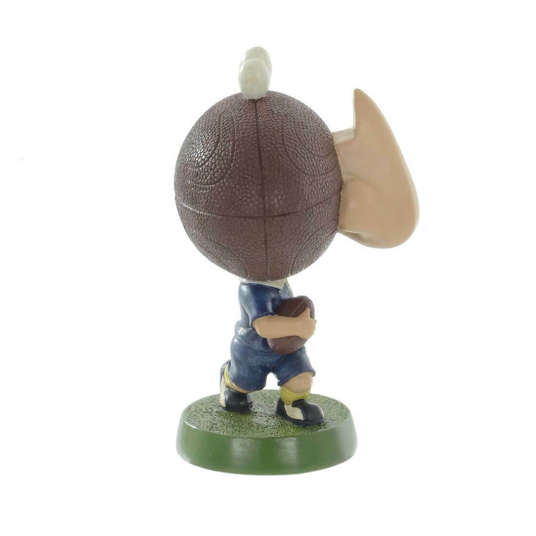 Side view of a glasses holder figure with rugby ball head