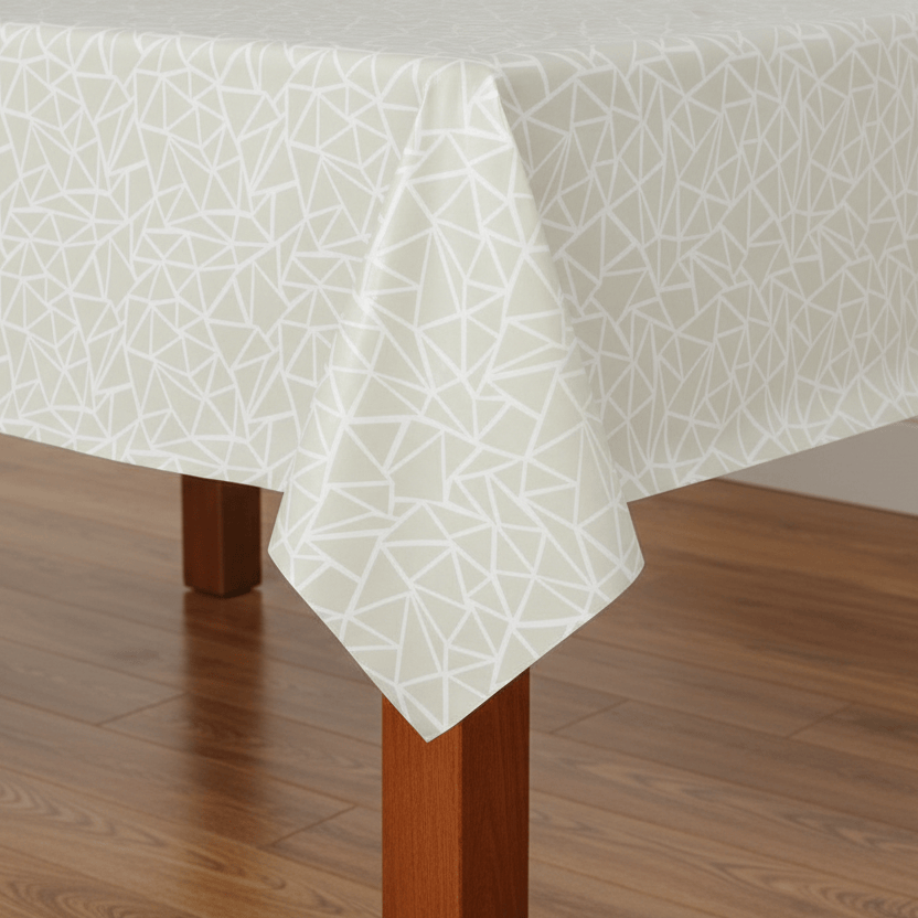 White geometric patterned tablecloth on a wooden table