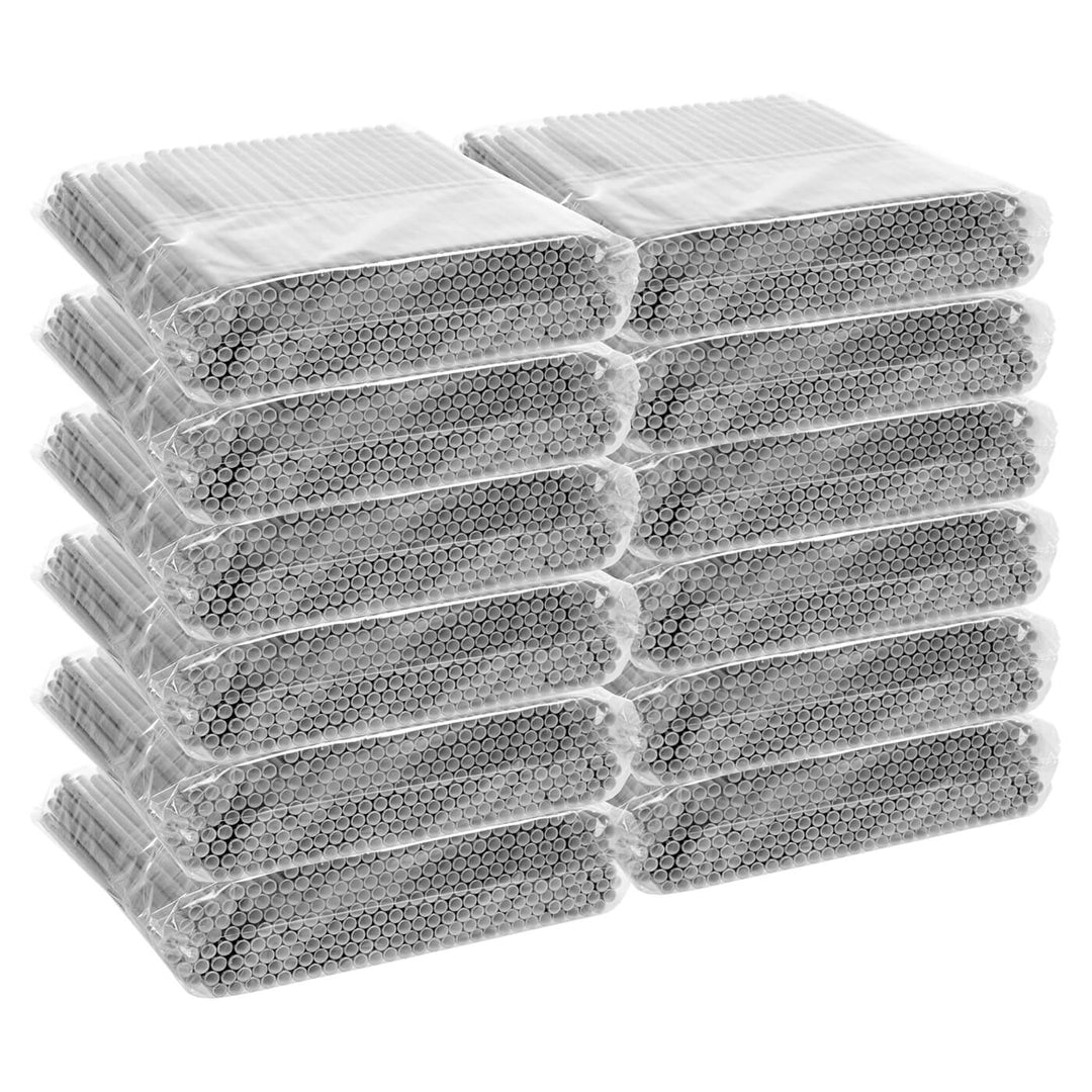 Multiple packages of silver straws stacked on a white background