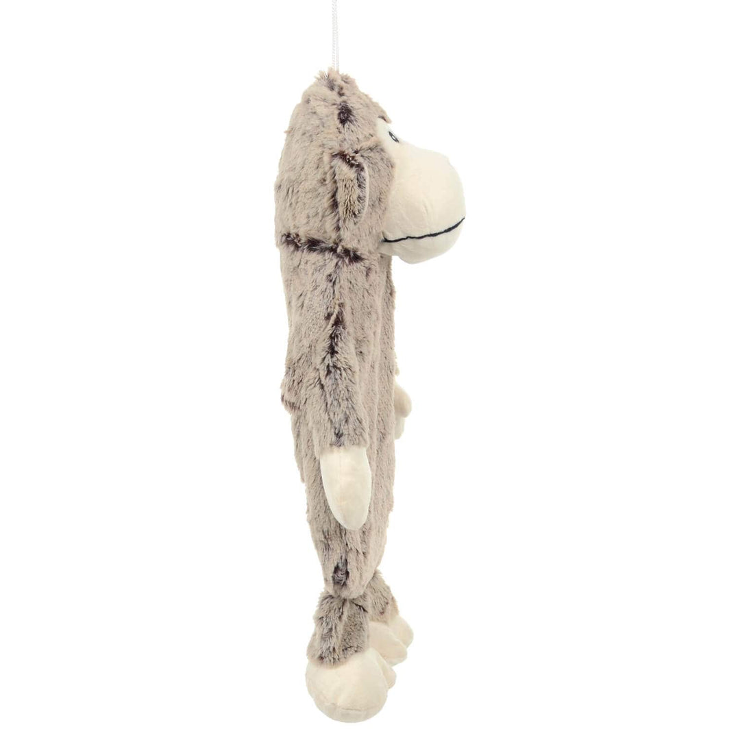 Side view of Plush Monkey hot water bottle with padded head hands and feet on a white background