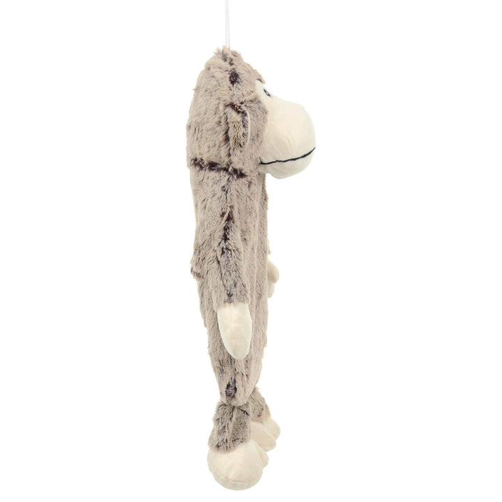 Side view of Plush Monkey hot water bottle with padded head hands and feet on a white background