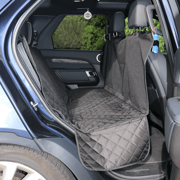 black heavy duty car seat cover in back of car with door open