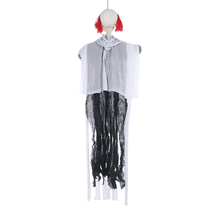 back view of scary clown with creepy white and black hanging fabric