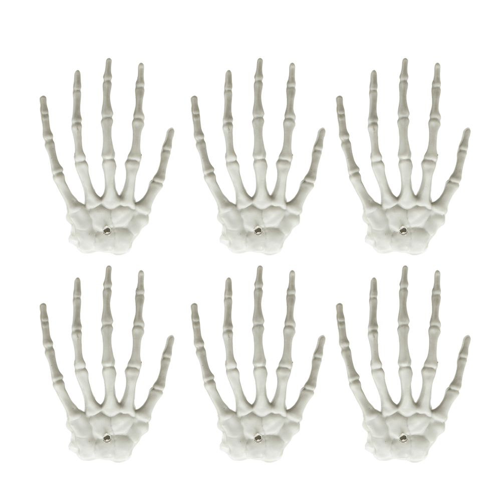 6 mini skeleton hand decorations on white background
