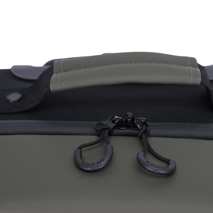 detail shot of rounded zip pulls with hodge and hodge brand logo