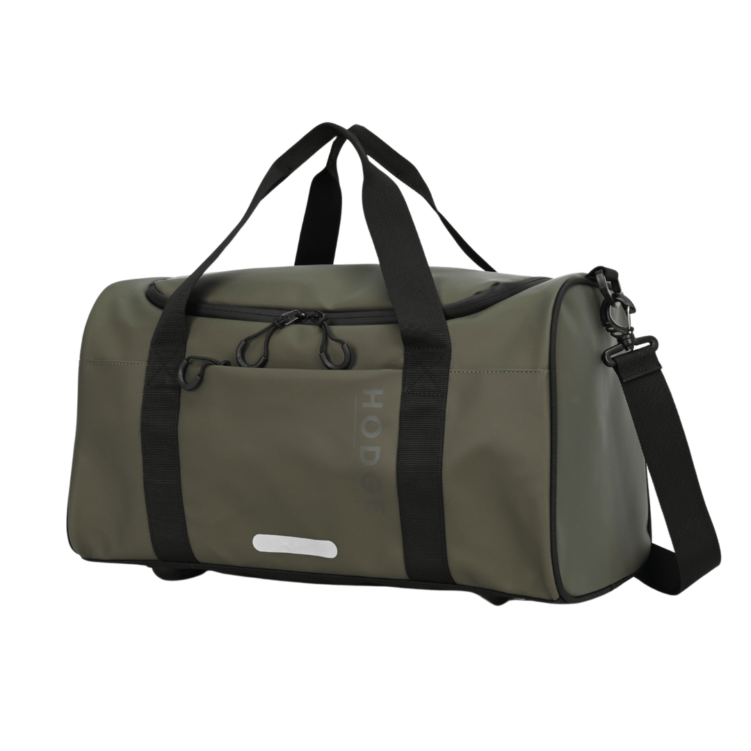 side view of hodge and hodge duffle bag in olice green with 2 carry handles, rounded rubber zips and reflective detailing