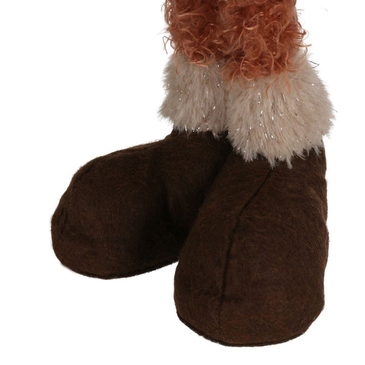 detail shot of brown boots on highland cow figure