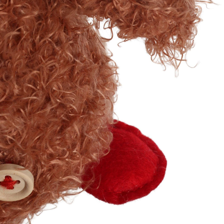 close up shot of padded felt feet on highland cow decoration