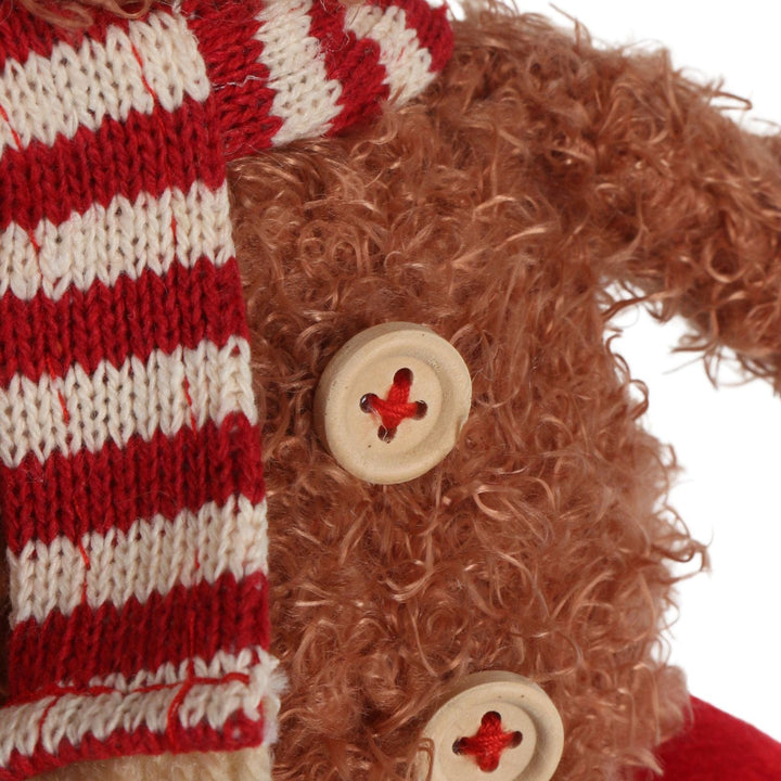 close up shot of wooden buttons on highland cow decoration